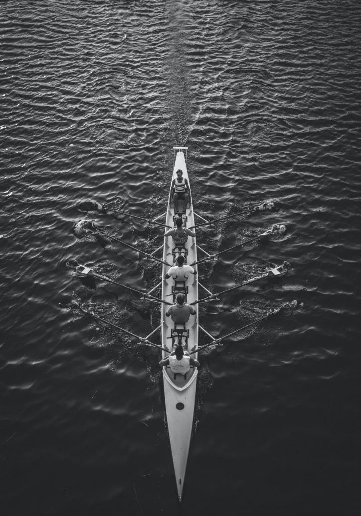 people riding boat on body of water