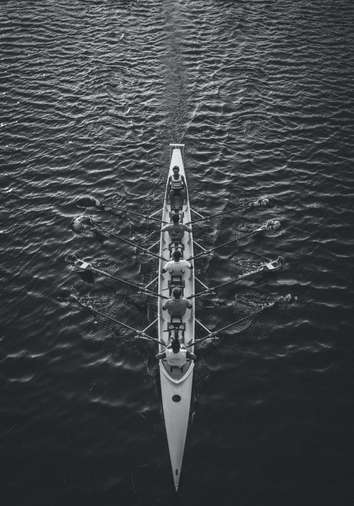 people riding boat on body of water